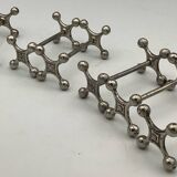Set of 7 vintage knife rests in the shape of crosses in silver-plated metal.