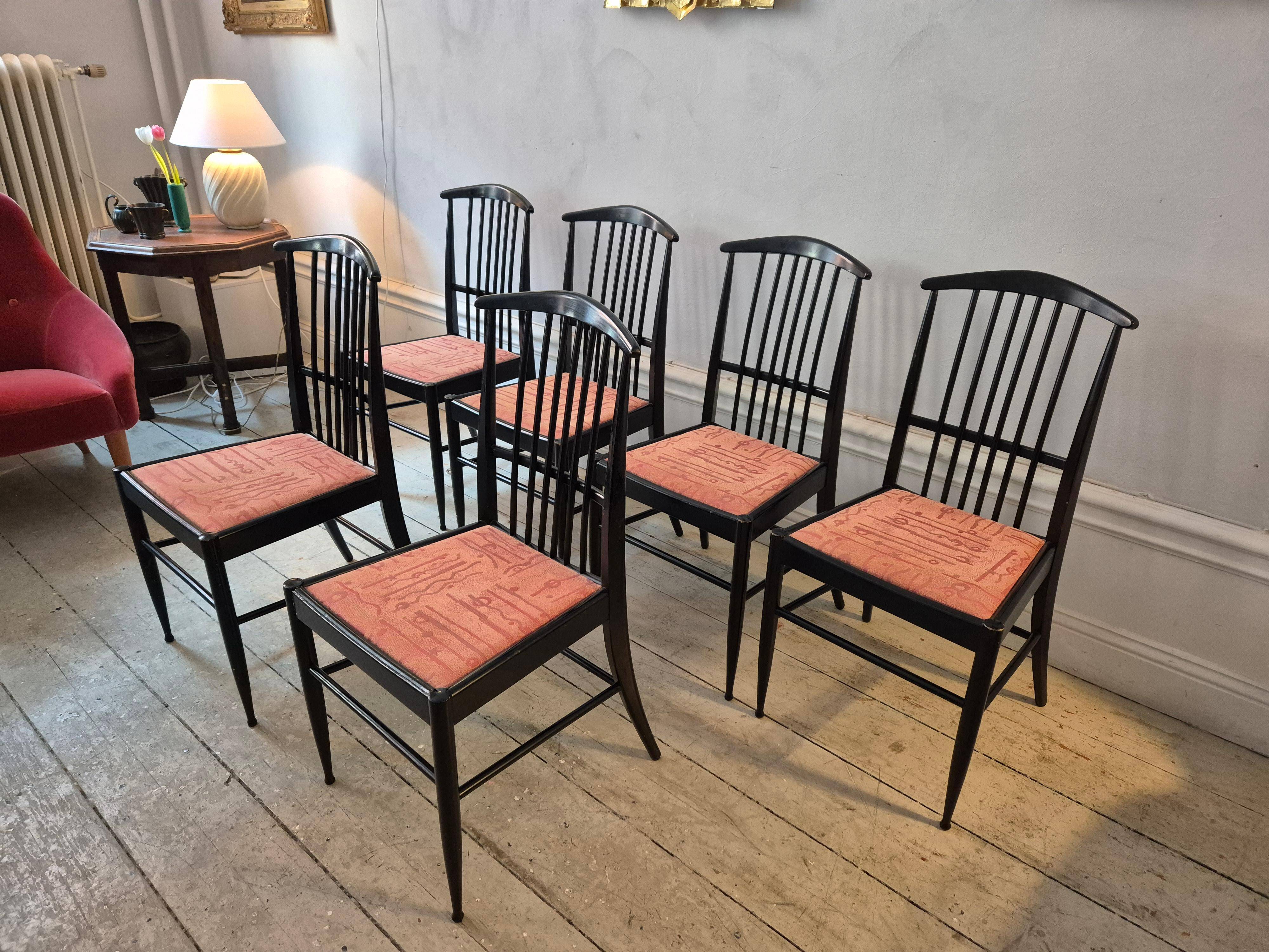 The Modernity, set of six chairs, model Charlotte, black lacquered wood.