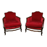Paire de fauteuils bergère style Louis XV en velours rouge