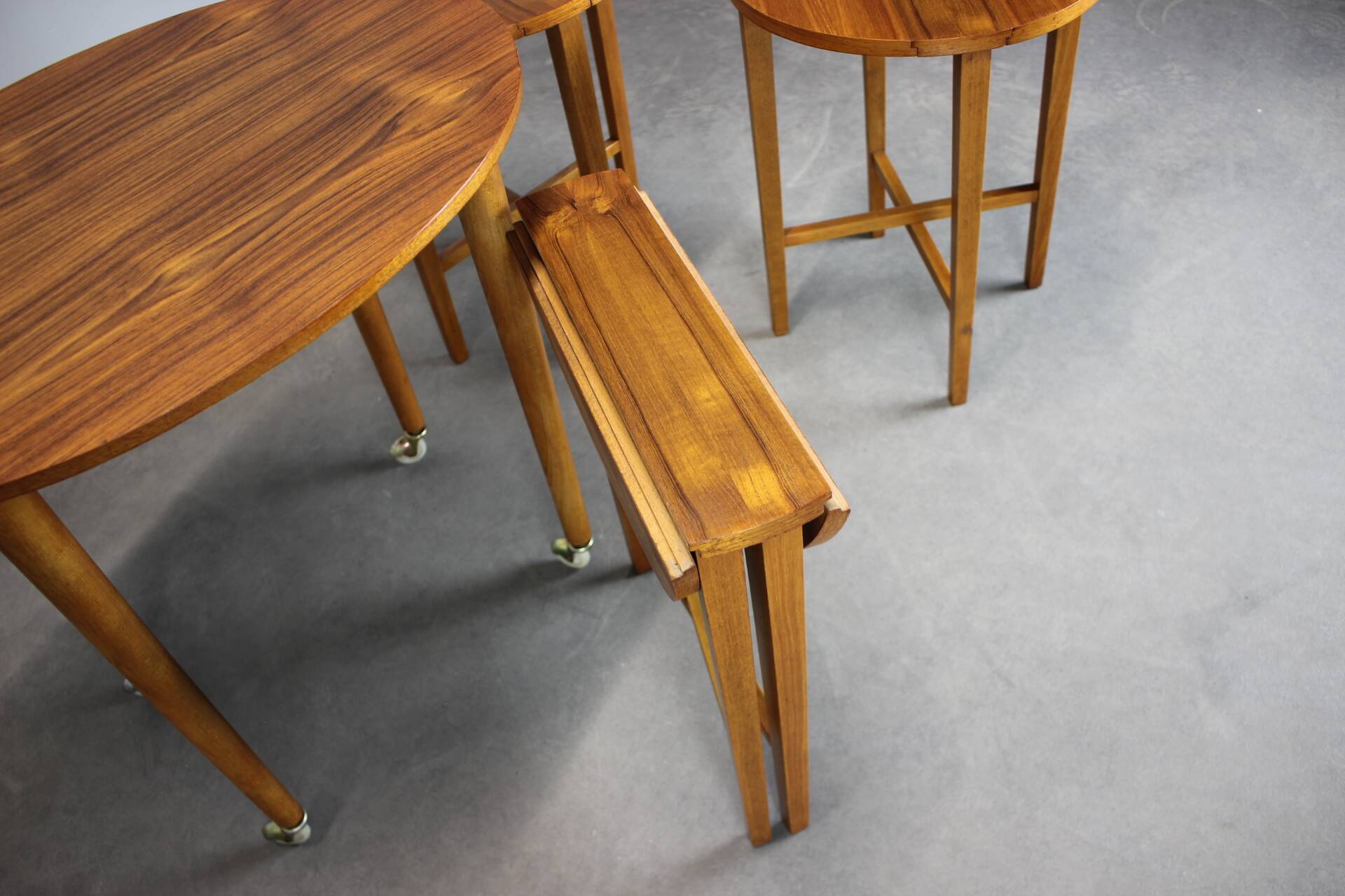 Restored Danish folding teak table with three nesting chairs by Poul Hundevad