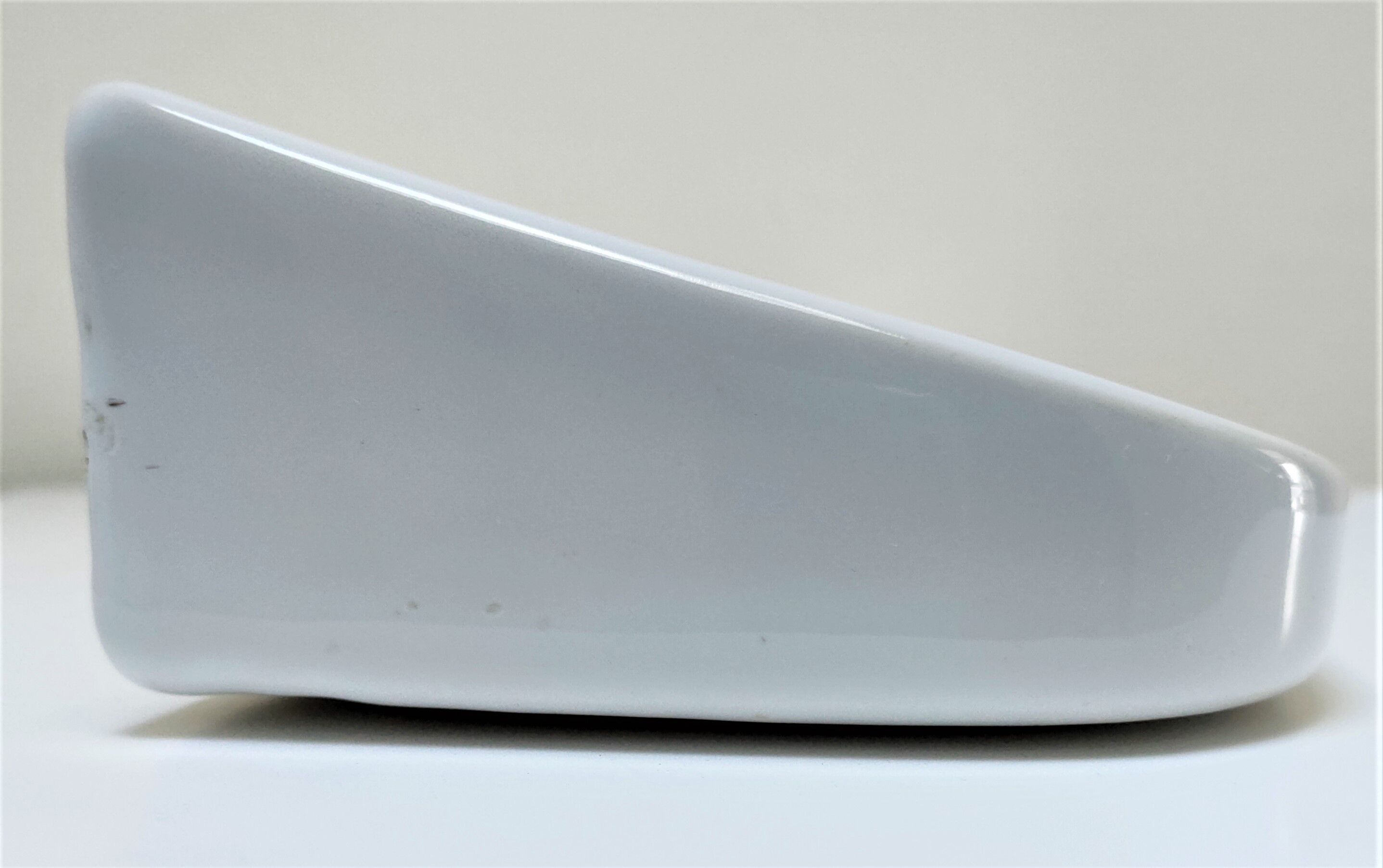 Vintage white glazed ceramic wall shelf
