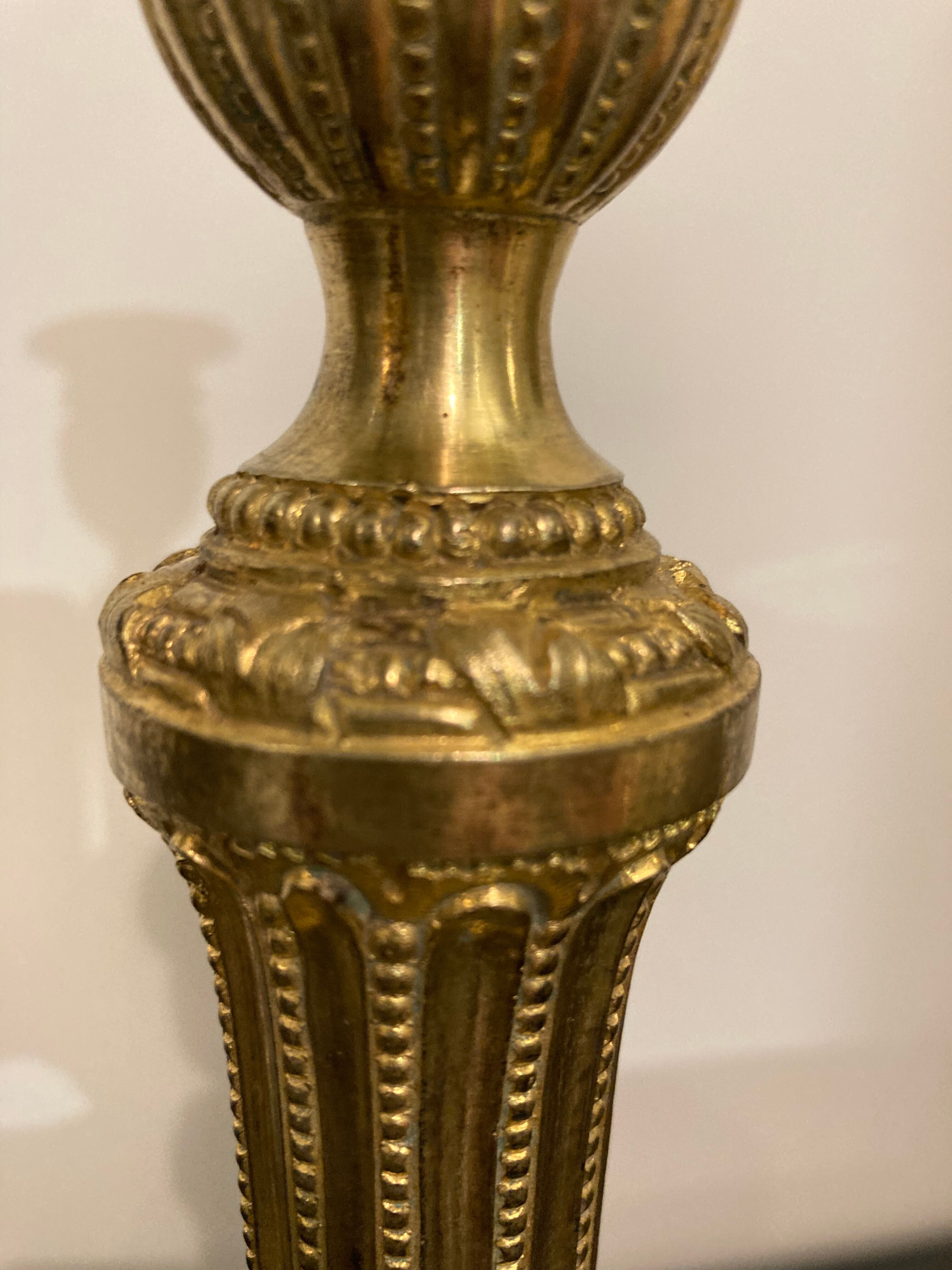 Pair of Louis XVI torch candlesticks in gilded bronze