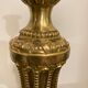 Pair of Louis XVI torch candlesticks in gilded bronze
