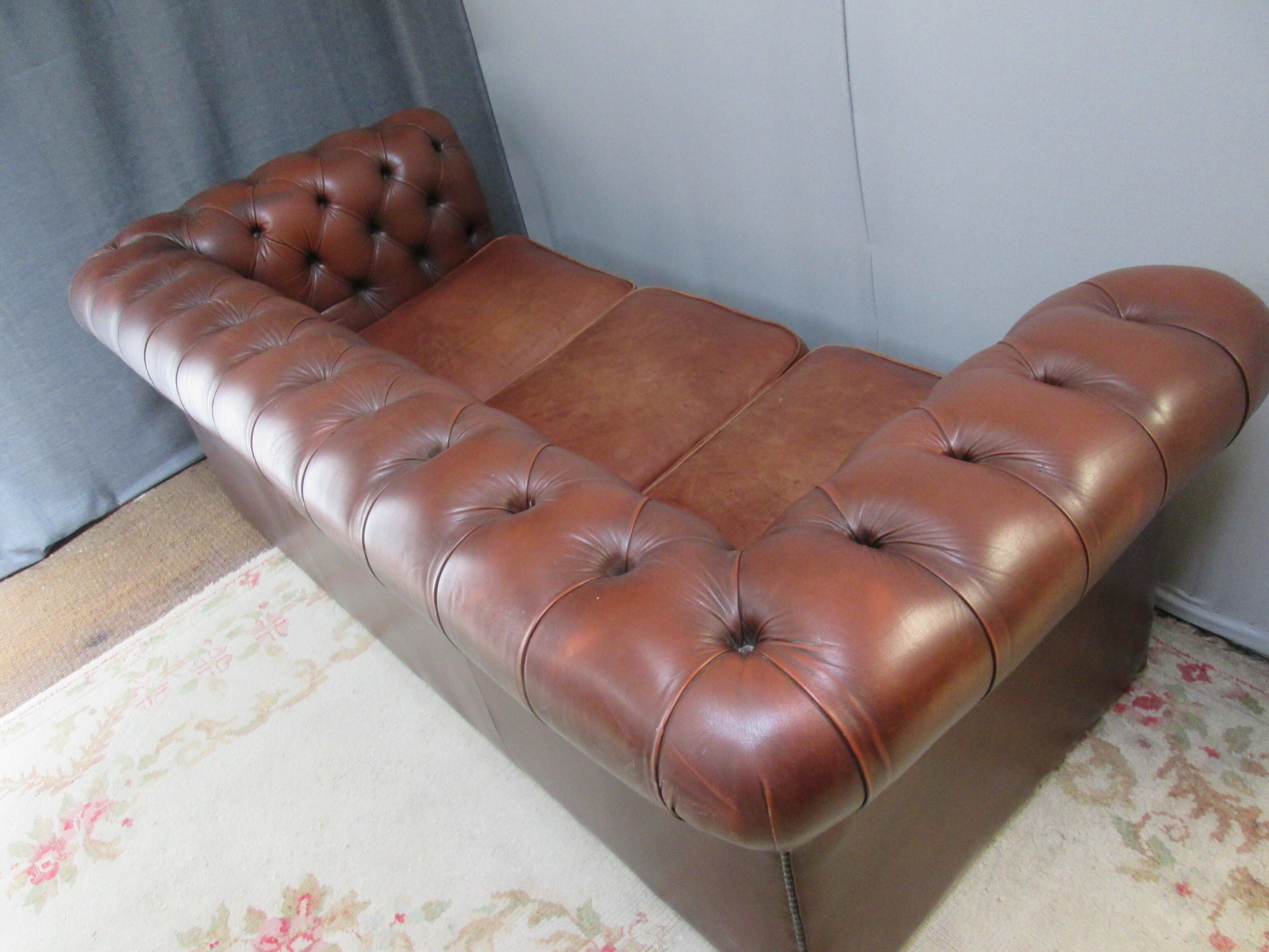 Brown leather chesterfield sofa
