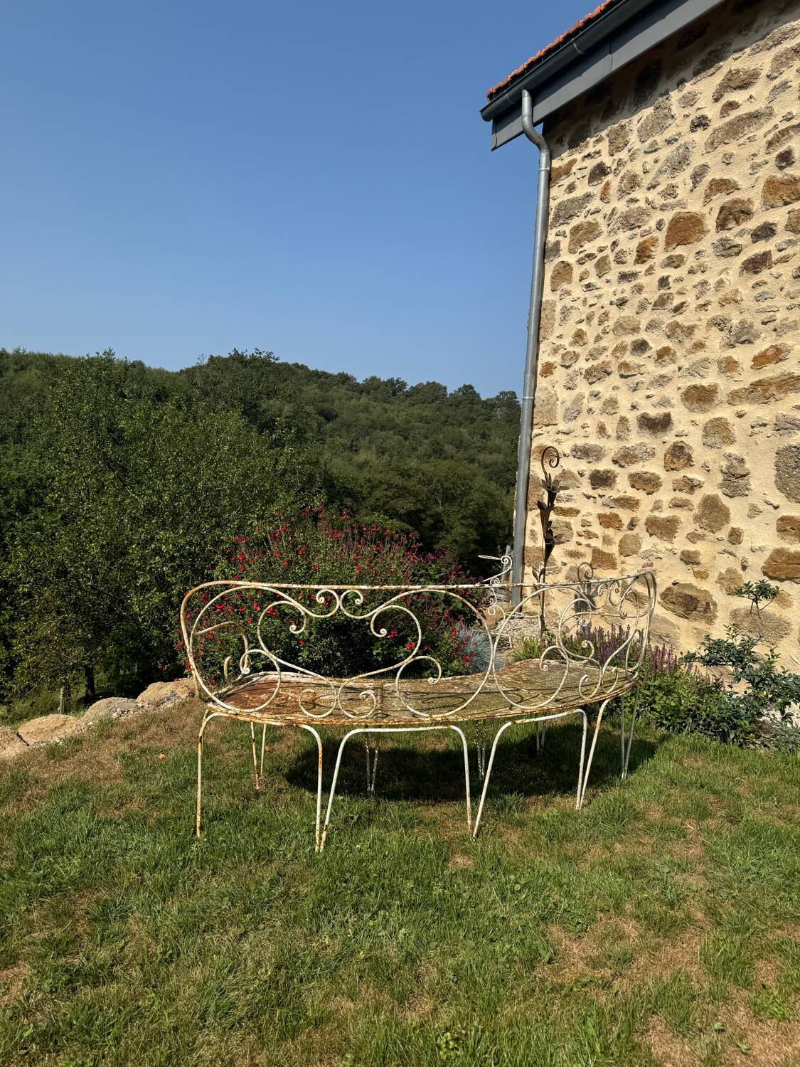 Wrought iron half-moon bench