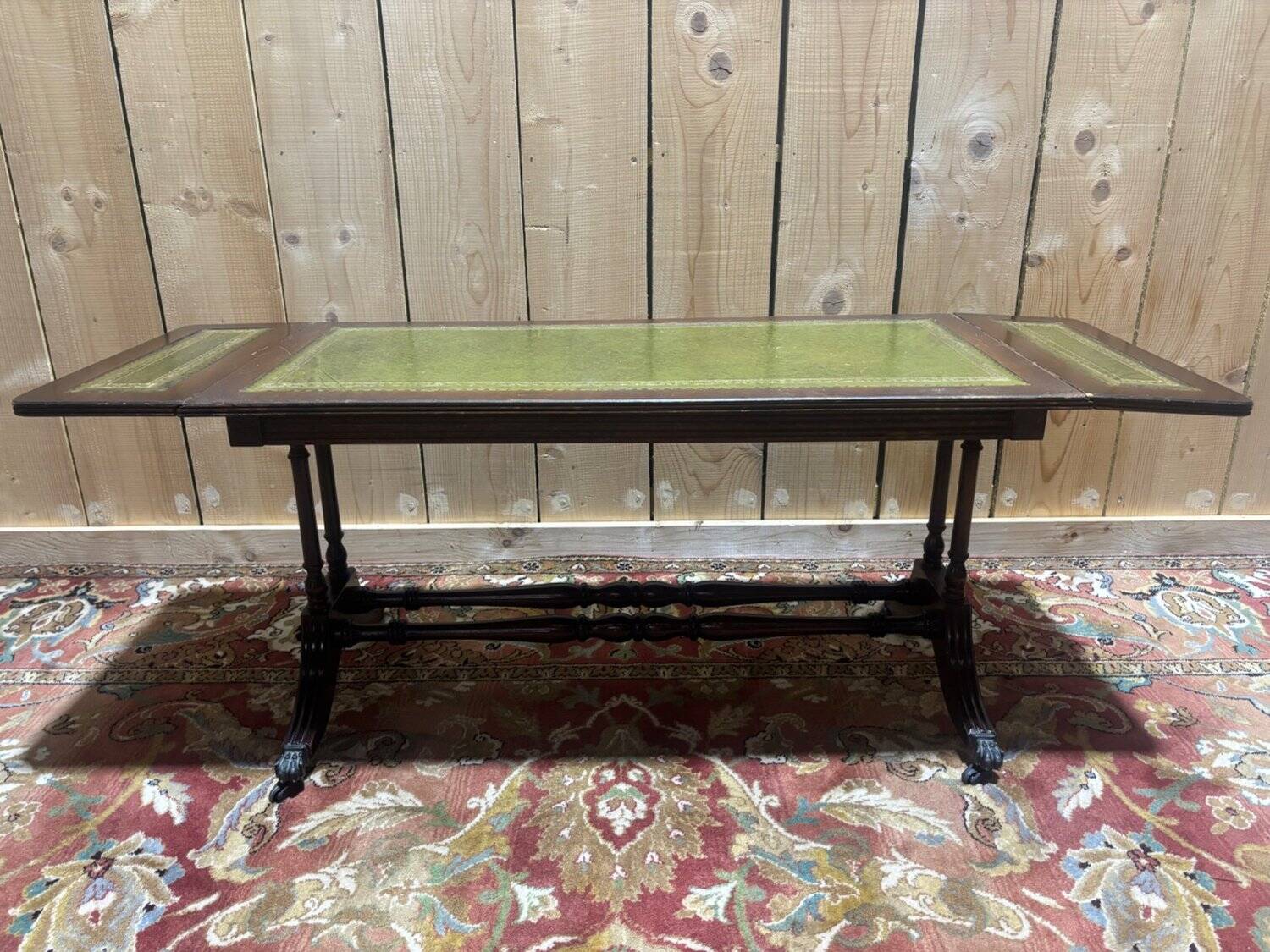 English Regency coffee table, mahogany & green stamped leather with gold.