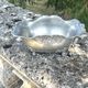 Footed pewter champagne cooler on claw feet with floral relief