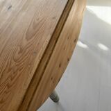 Round wooden table with flaps