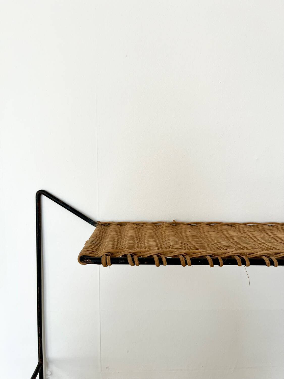 Raoul Guys rattan wall shelf 1950