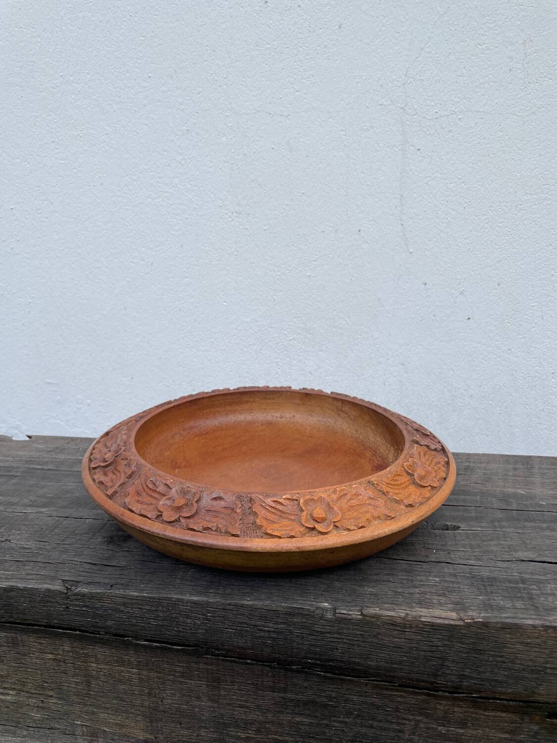 Carved wooden pocket emptier