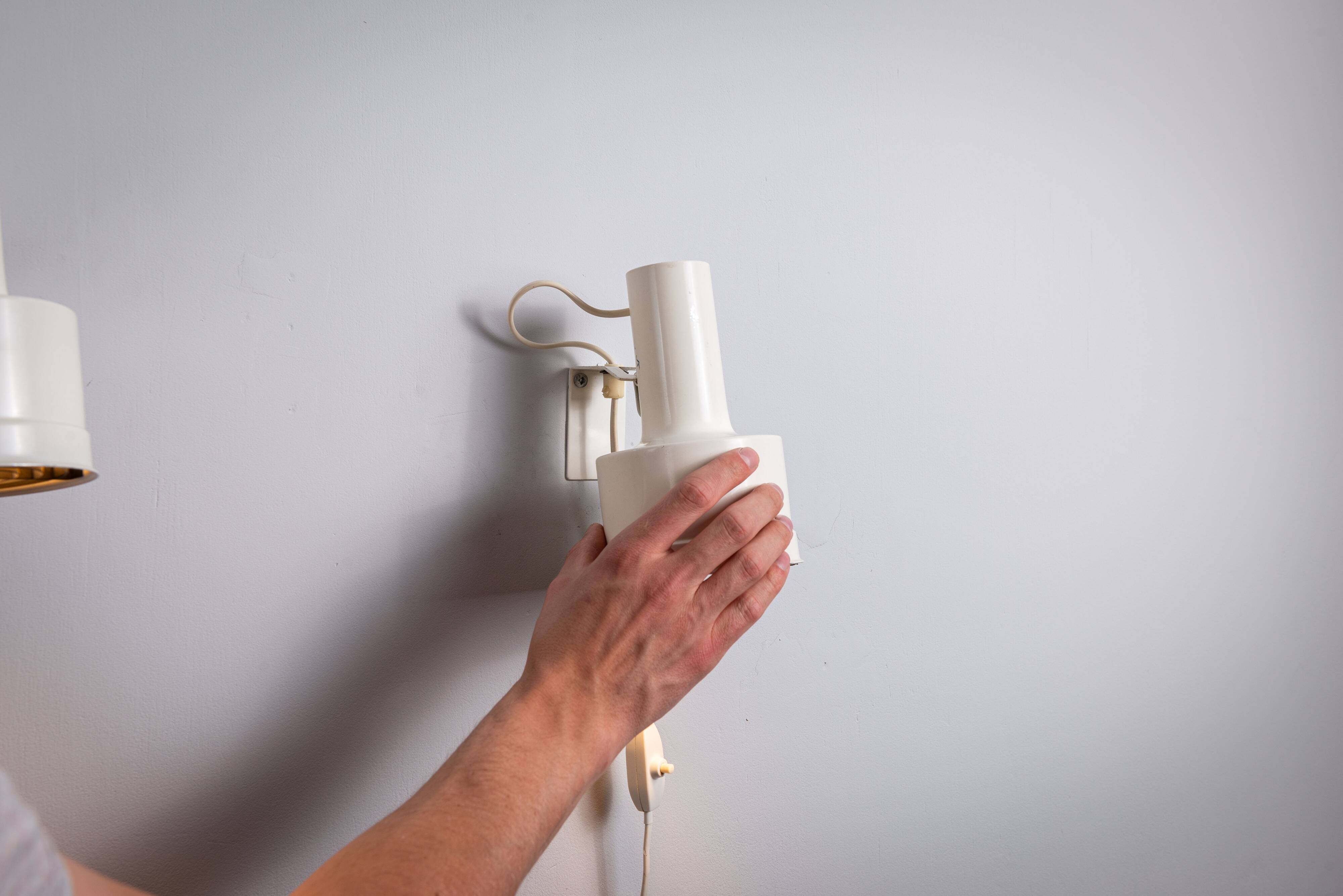 Pair of adjustable wall lamps designed by Per Sundstedt for Kosta Lampan
