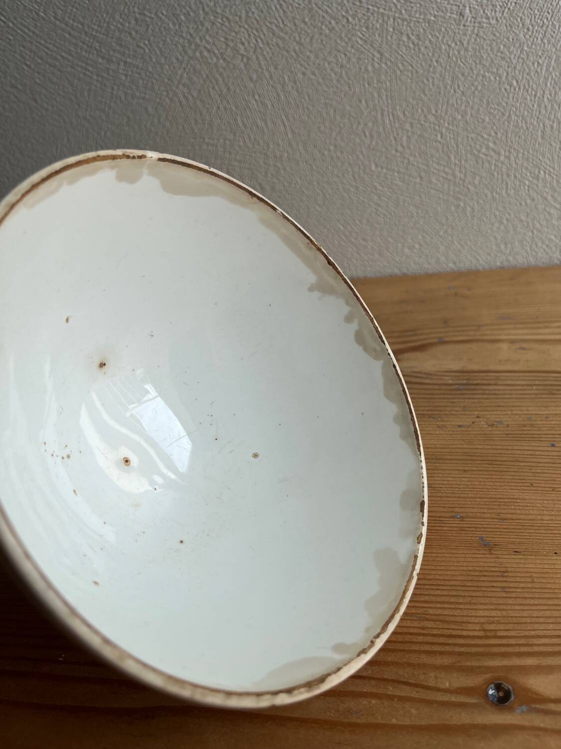 Old earthenware bowl on a pedestal, Badonviller, France.