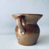 Old pitcher in glazed terracotta