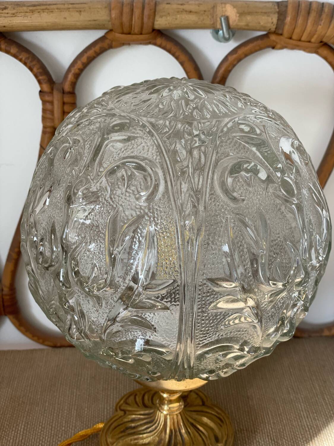 Textured round globe table lamp with a gold brass base