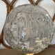 Textured round globe table lamp with a gold brass base