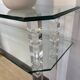 Hollywood Regency console style in travertine, glass, and Lucite.