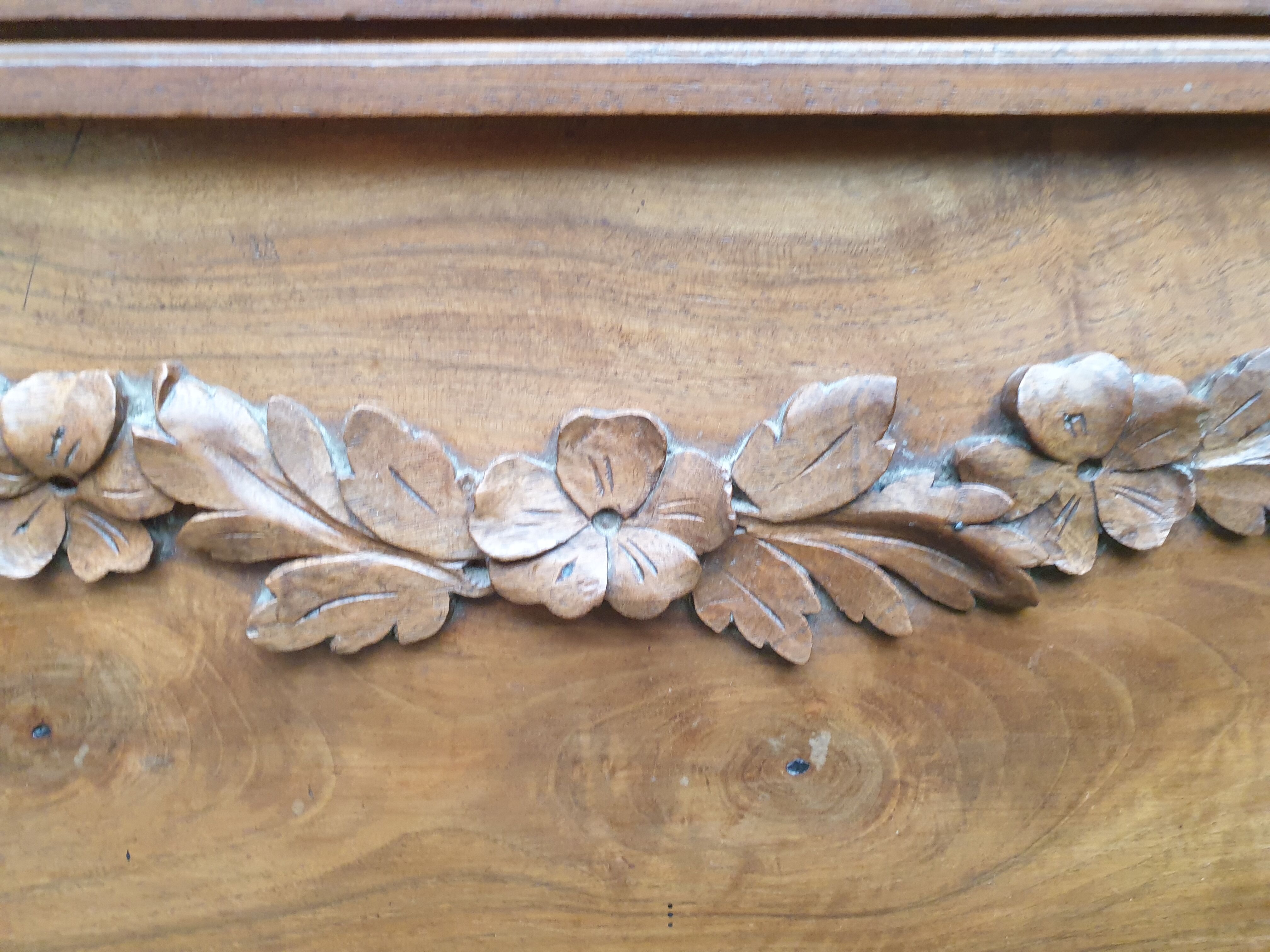 Carved walnut headboard