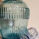 Blue glass carafe with vintage pegs