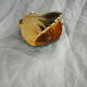 Porcelain pocket tray in the shape of a golden scallop shell with duck green background from the 50s/60s