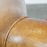 Set of 2 cognac-colored sheepskin club chairs with colorful fabric cushions