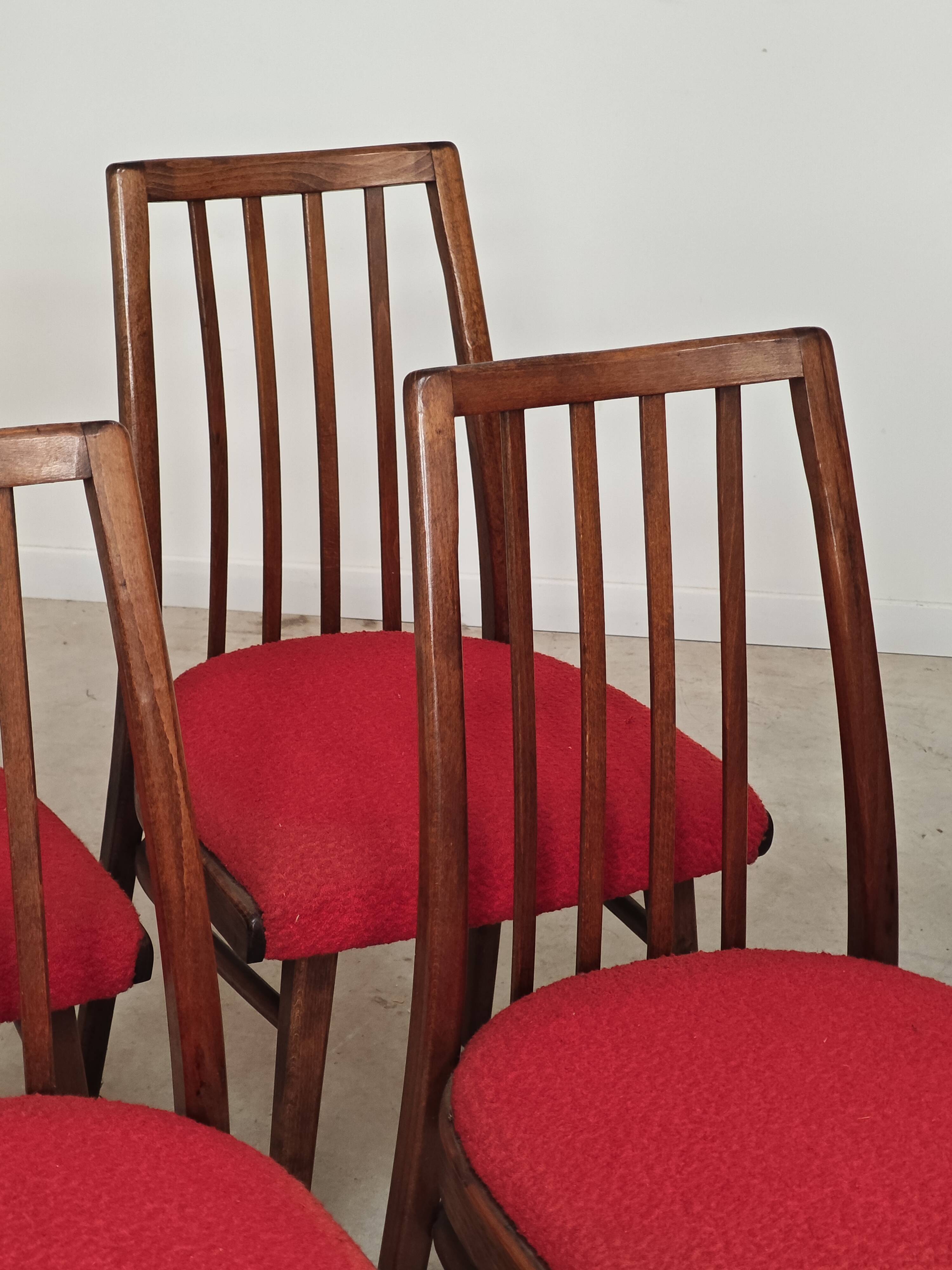 Set of 4 red dining chairs by Antonin Suman for Interier Praha.
