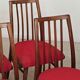 Set of 4 red dining chairs by Antonin Suman for Interier Praha.