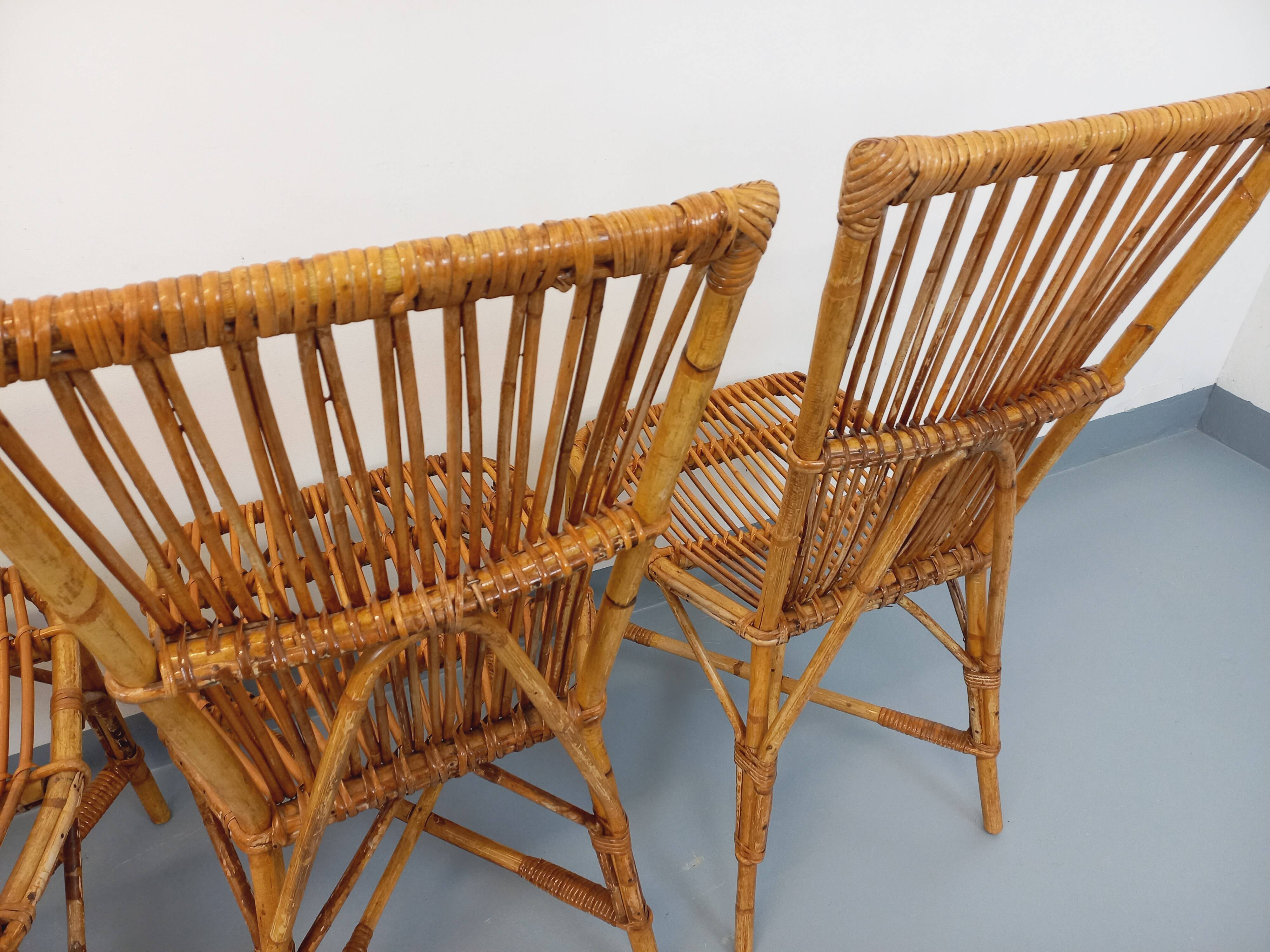 Set of 4 vintage Audoux Minet rattan chairs from the 1950s and 60s.