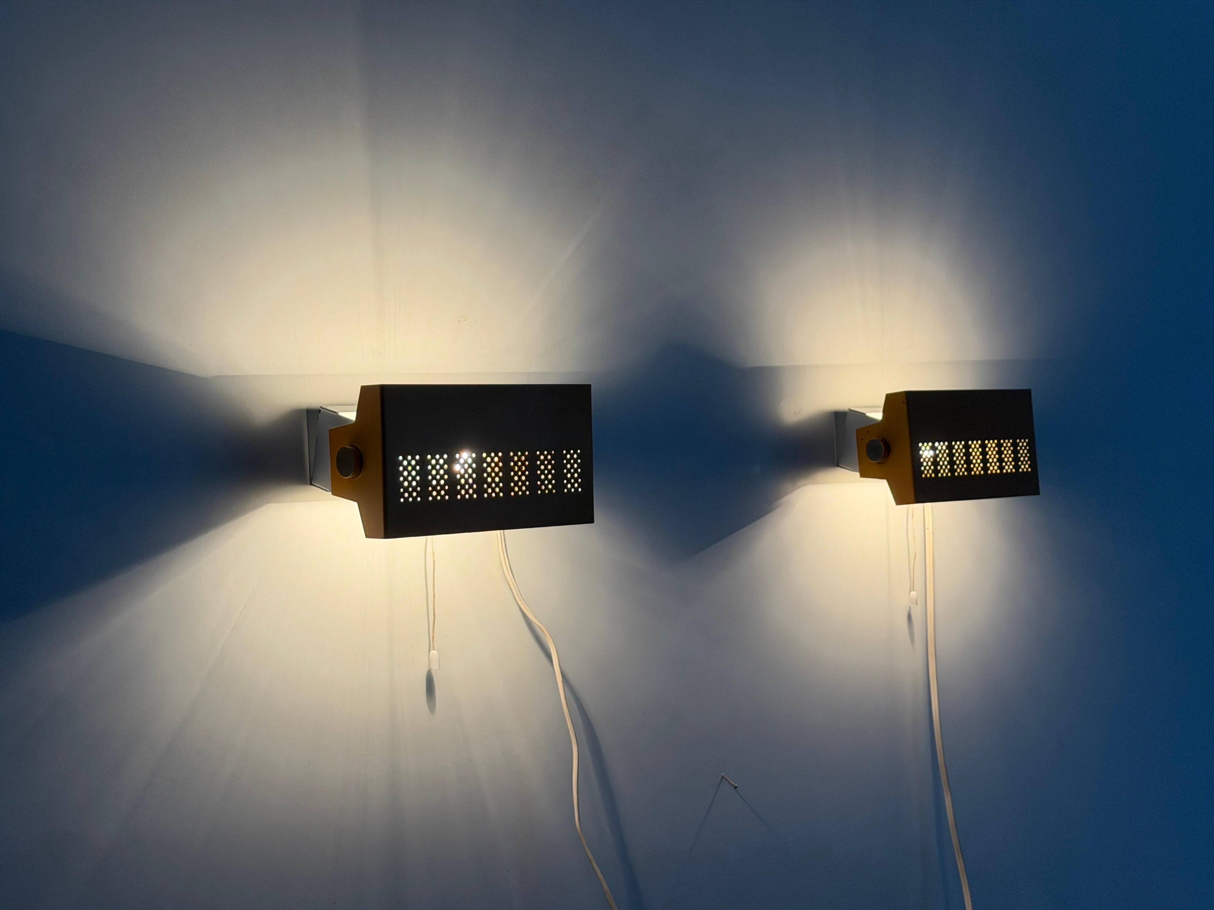 Pair of yellow metal wall lights from the mid-century by N Leuchten, 1960s, Germany.
