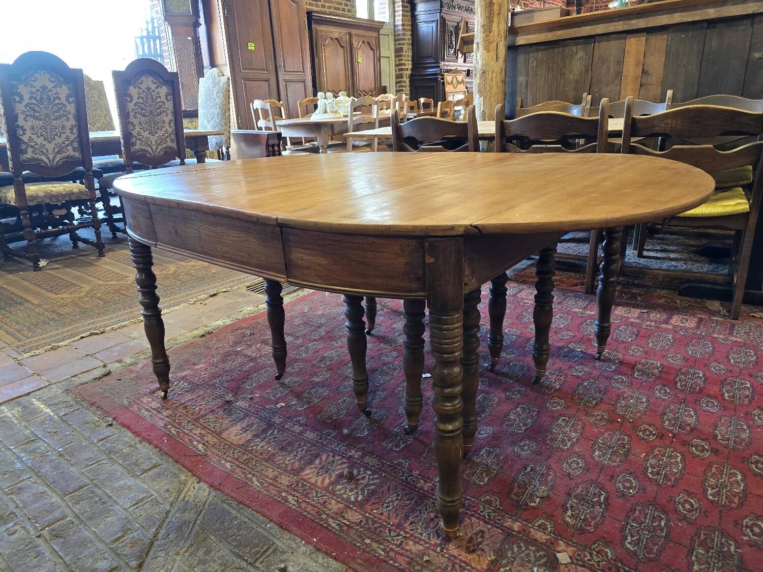 12-foot round oak table with 7 extensions / 20 people