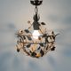 Patinated metal ceiling light with a floral and leaf pattern, 1950s, Italy.