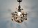 Patinated metal ceiling light with a floral and leaf pattern, 1950s, Italy.