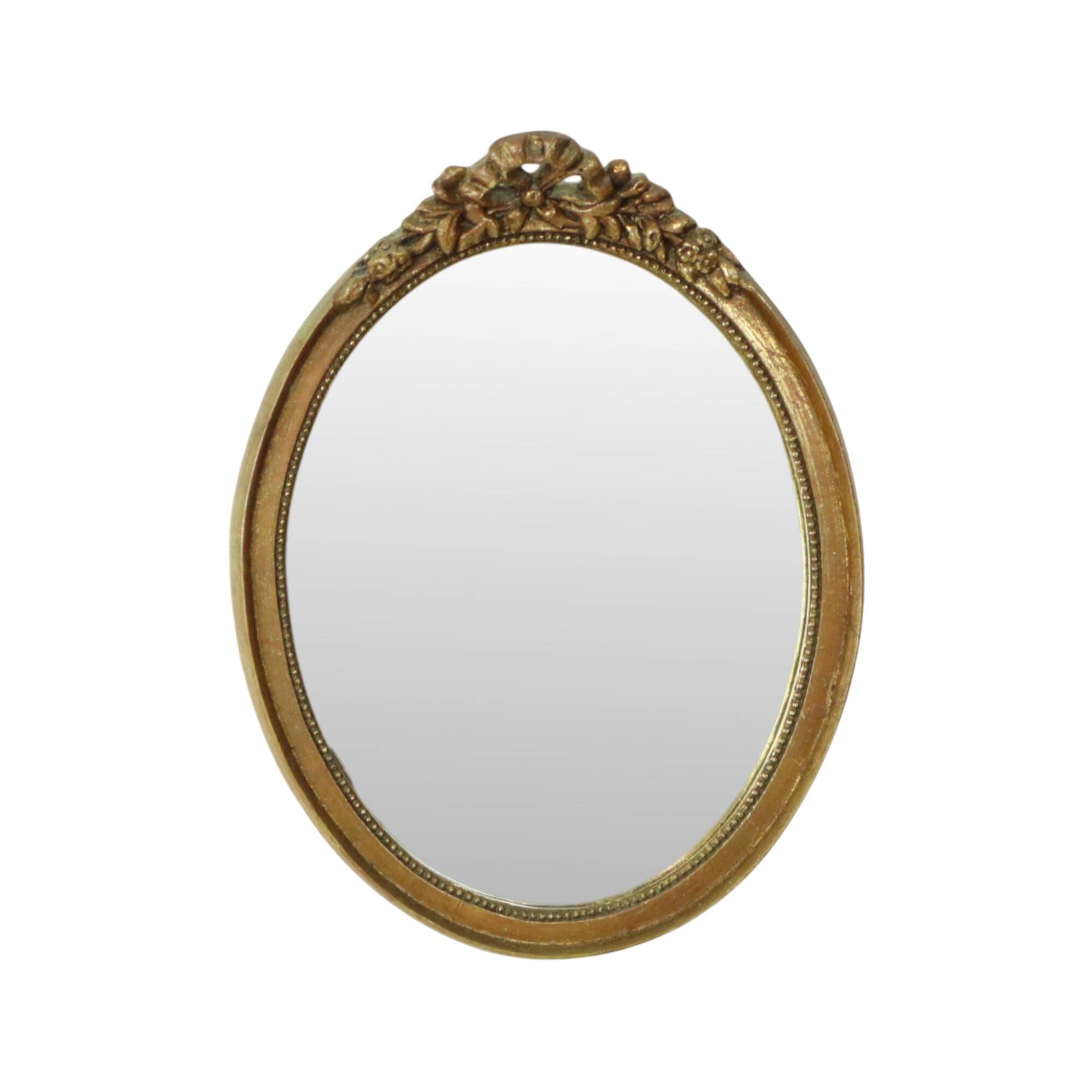Miroir ovale vintage en résine dorée à la feuille d'or, style années 60. Classique.