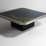 Unique regency coffee table in chrome and brass.
