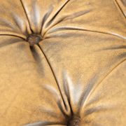 Elegant cowhide English chesterfield ottoman finished with decorative nails