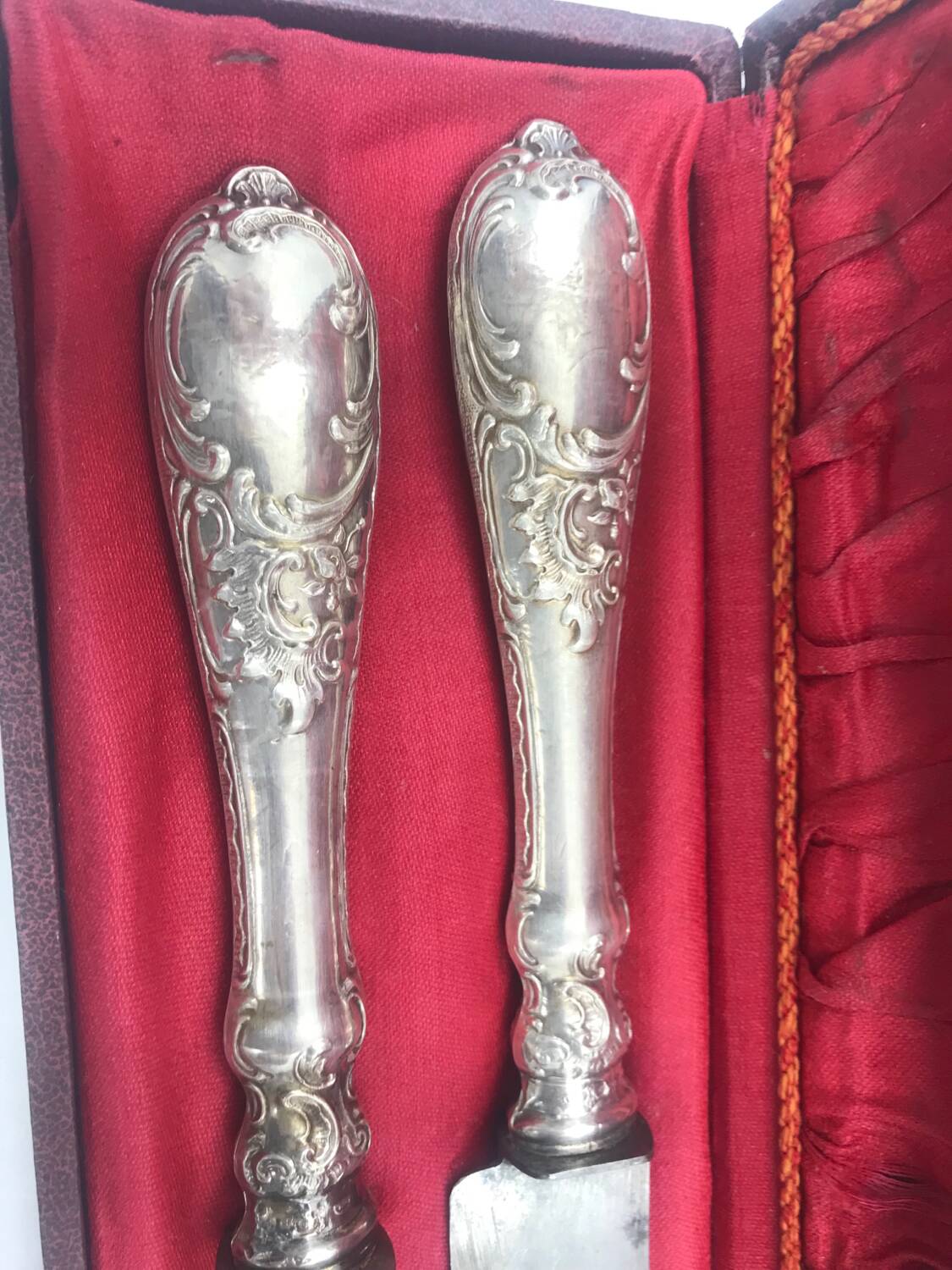 Antique silver-plated metal serving cutlery.