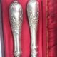 Antique silver-plated metal serving cutlery.