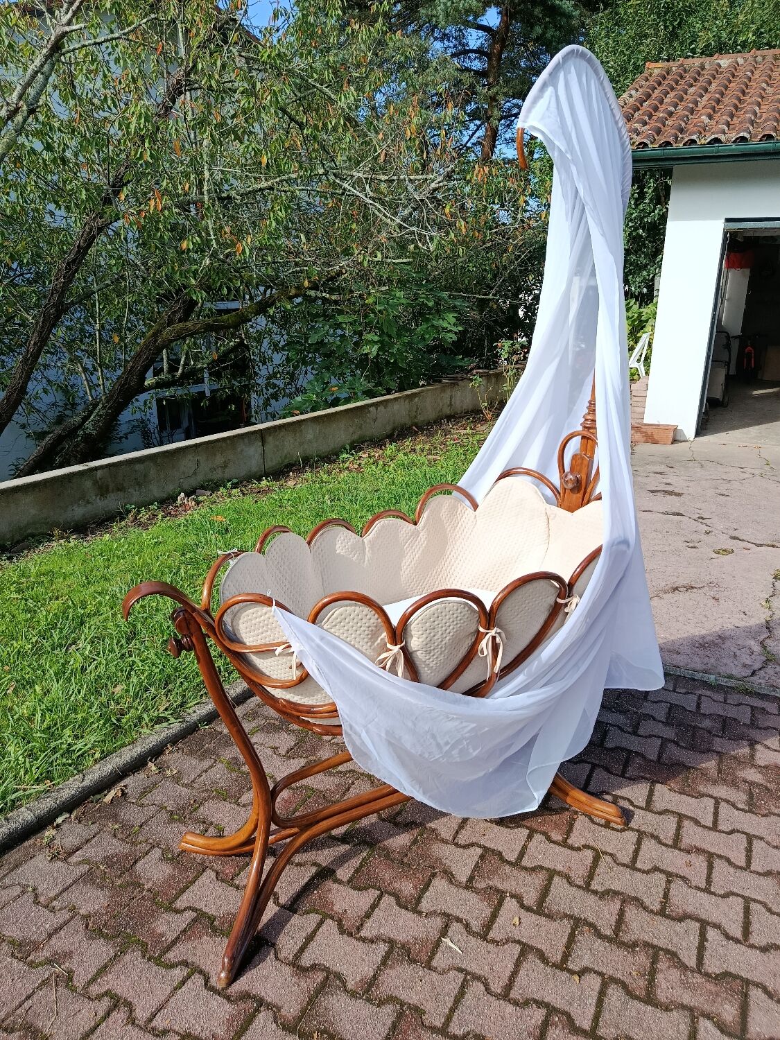 Antique cradle by J&J Khon