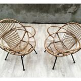 Pair of rattan shell chairs with metallic feet