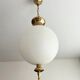 Glass and brass suspension globe