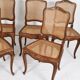 Series of 5 cane chairs, backs and seats, Louis XV style