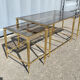 Table basse et paire de bout de canapé vintage en laiton doré et verre fumé 1960 style maison jansen