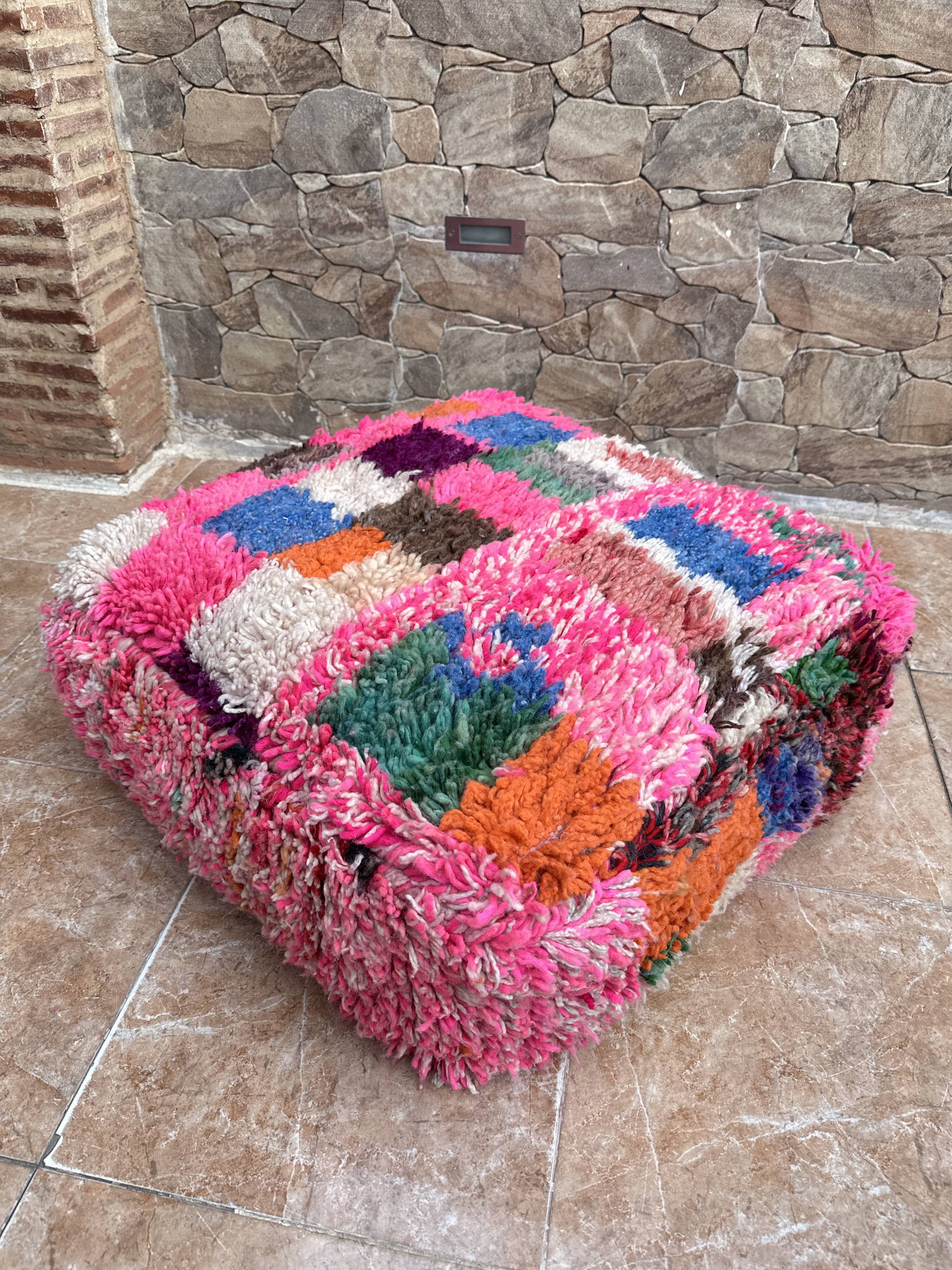 Berber floor pouf: Handwoven Moroccan wool cushion.