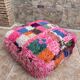Berber floor pouf: Handwoven Moroccan wool cushion.