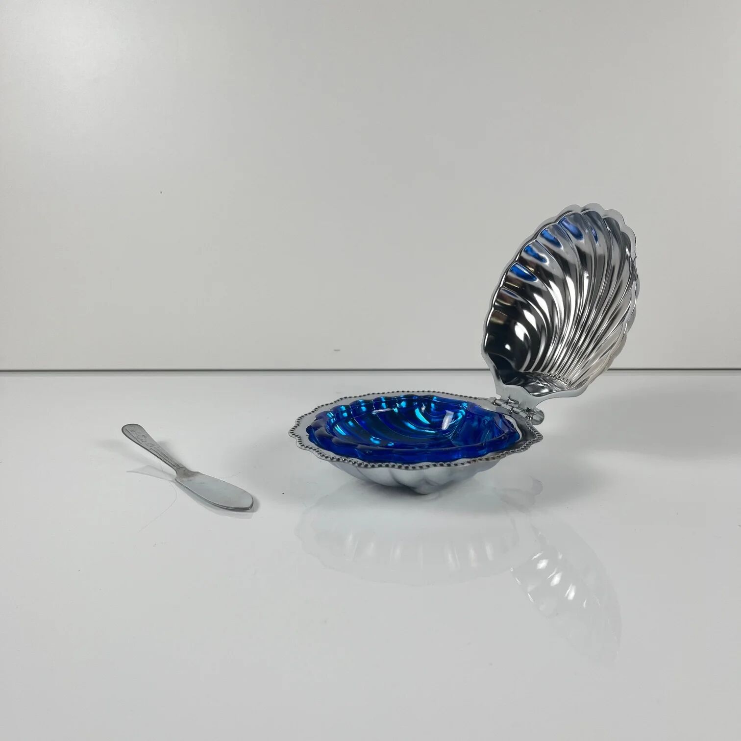 Metal shell butter dish with blue insert, 1970 with knife.