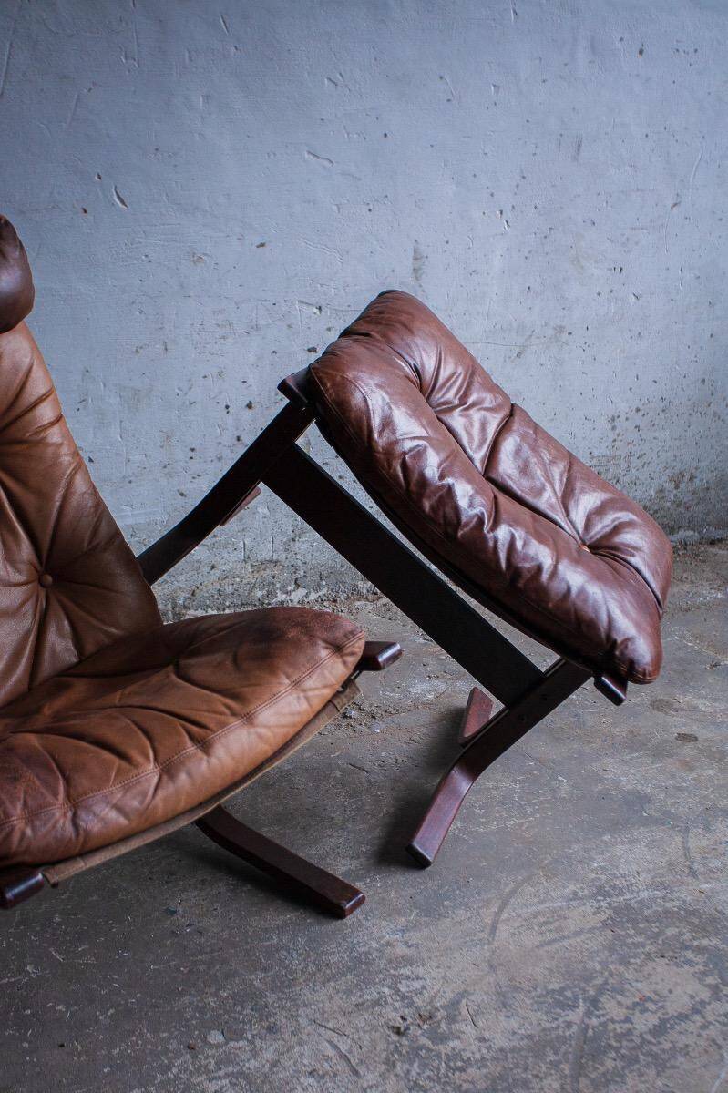 Siesta armchair by Ingmar Relling with ottoman — bentwood dark brown frame, cognac leather