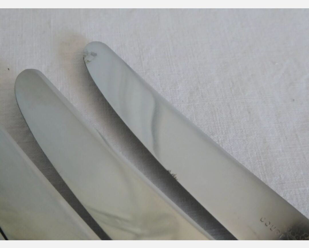 12 silver metal knives