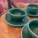 Set of 4 green ceramic coffee cups and plates