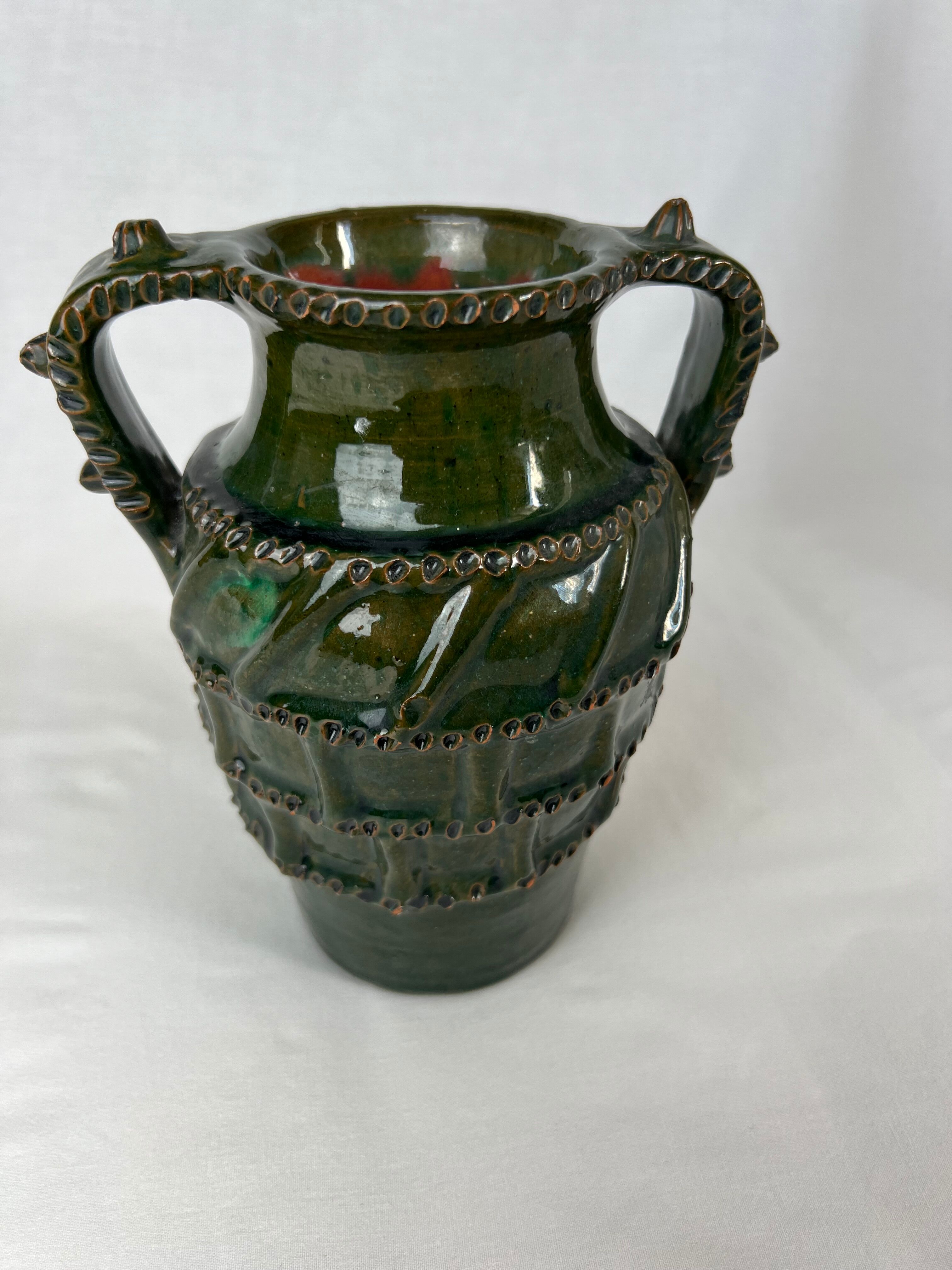 Terracotta jar with dark green handles