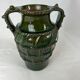 Terracotta jar with dark green handles