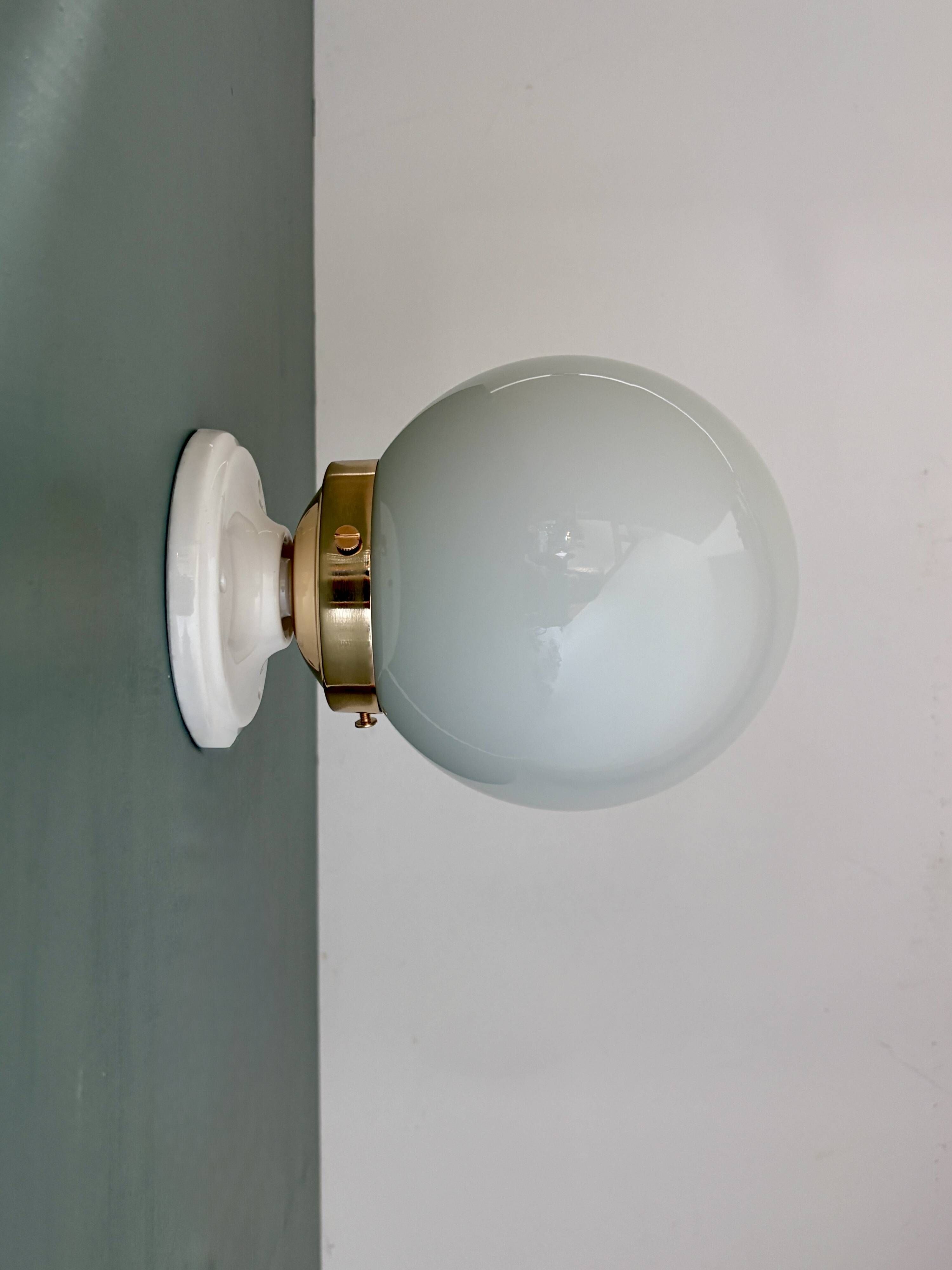 Vintage globe wall or ceiling light in white opaline.